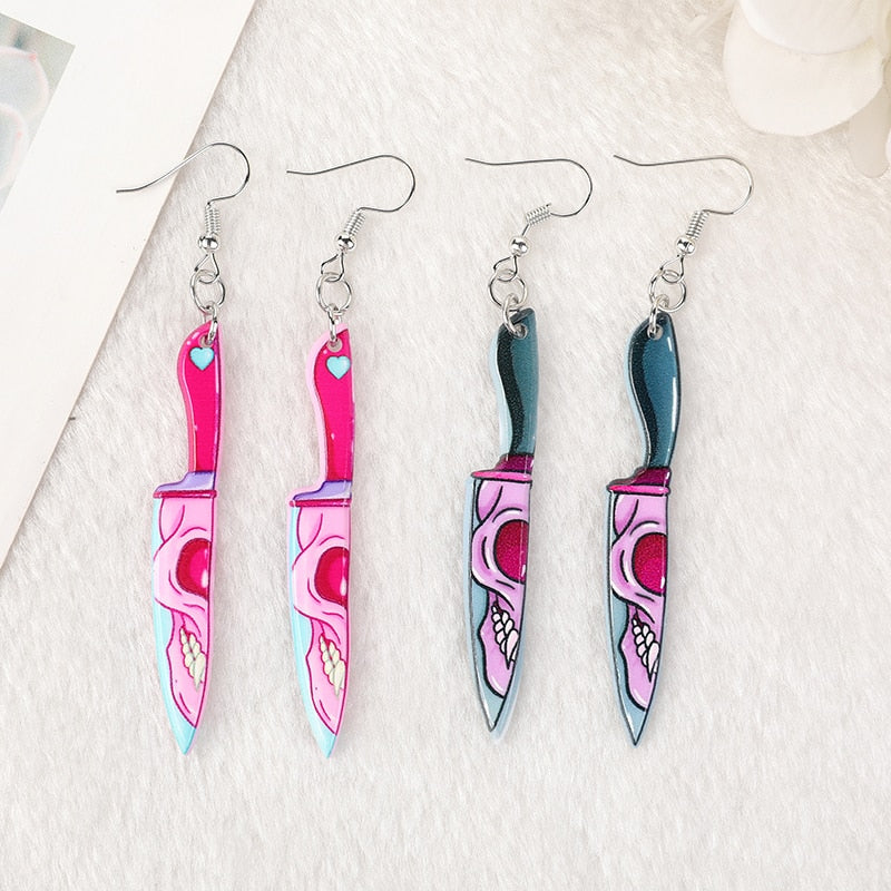 Women’s pink and green skull knife earrings