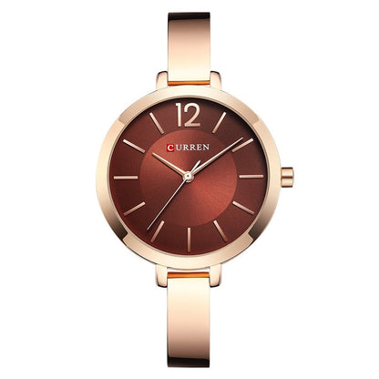 Women’s rose gold and coffee watch