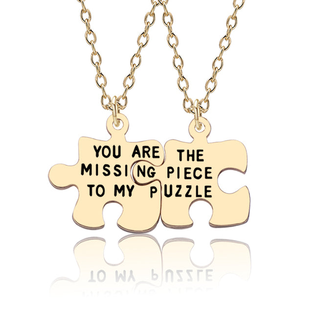 Couple’s matching gold puzzle piece necklace