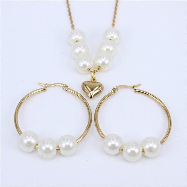 Women’s pearl and gold necklace and earrings set