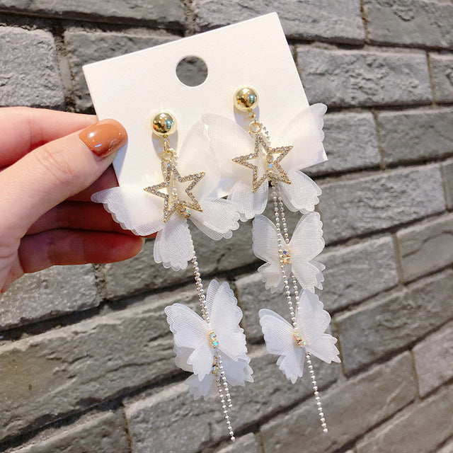 White star diamonds with white butterfly drop earrings