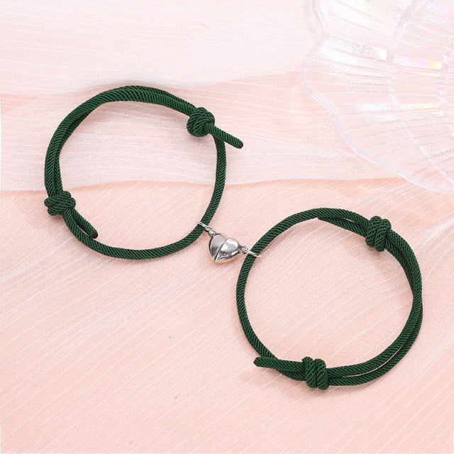 Couple’s matching green heart connecting bracelets