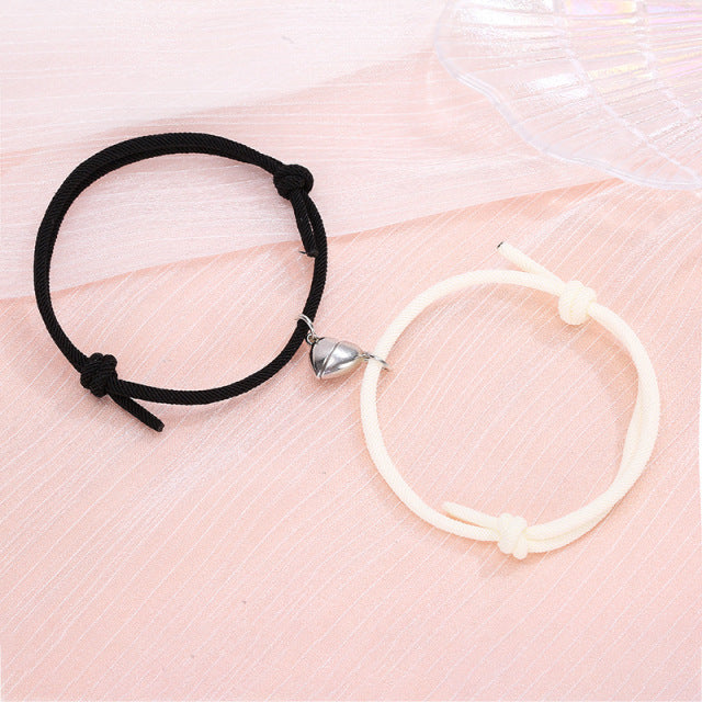 Couple’s matching black and white connecting heart bracelet set