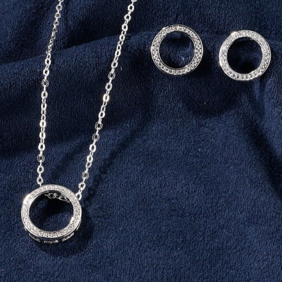 Women’s silver and diamonds circle necklace and earrings set