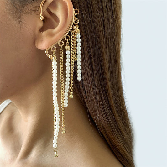 Women’s gold and pearls cuff earring